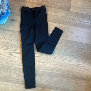 We the free black skinny jeans make your butt look great! Size 24